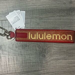 NWT Lululemon Red and Gold Keychain
